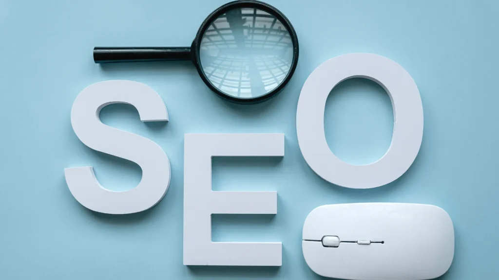 Magnifying glass over the word "SEO" with a mouse, symbolizing the focus on organic SEO in Perth