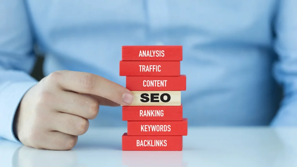 A hand displaying various link building strategies, including second-tier link building tactics like guest posts and sponsorships.