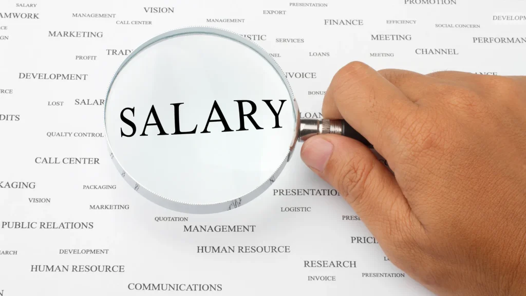 SEO Specialist Salary UK shown through a magnifying glass over the word 'Salary' in a business context.