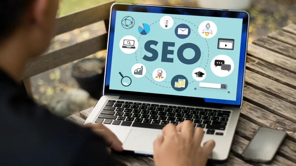 SEO Without Link Building with laptop displaying SEO icons, focusing on tactics other than backlinks for better rankings.